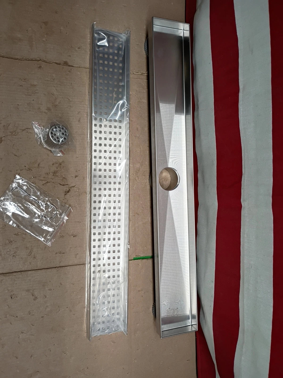 Oatey Designline 24 in Stainless Steel. Linear Shower Drain. with Square Pattern