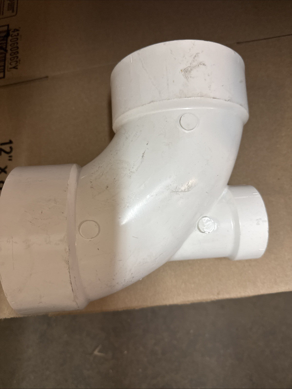 4" x 4" x 2" PVC DWV 90-Degree Hub x Hub Elbow Fitting with 2” Low Heel Inlet