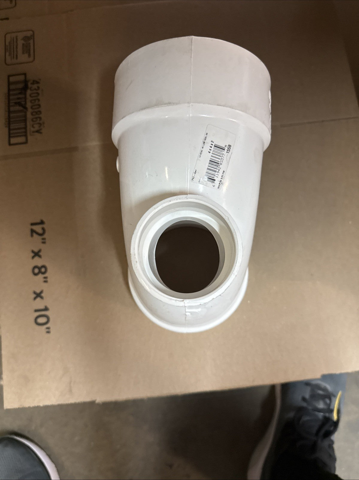 4" x 4" x 2" PVC DWV 90-Degree Hub x Hub Elbow Fitting with 2” Low Heel Inlet